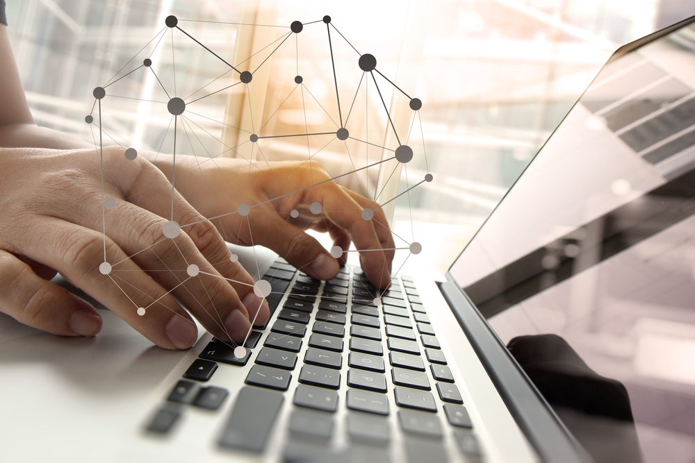 Double exposure of business man hand working on blank screen laptop computer on wooden desk as concept with social media diagram Double exposure of business man hand working on blank screen laptop computer on wooden desk as concept with social media diagram